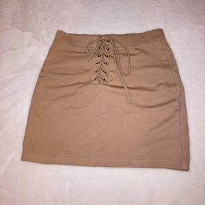 tan/nude skirt, cute lace up front